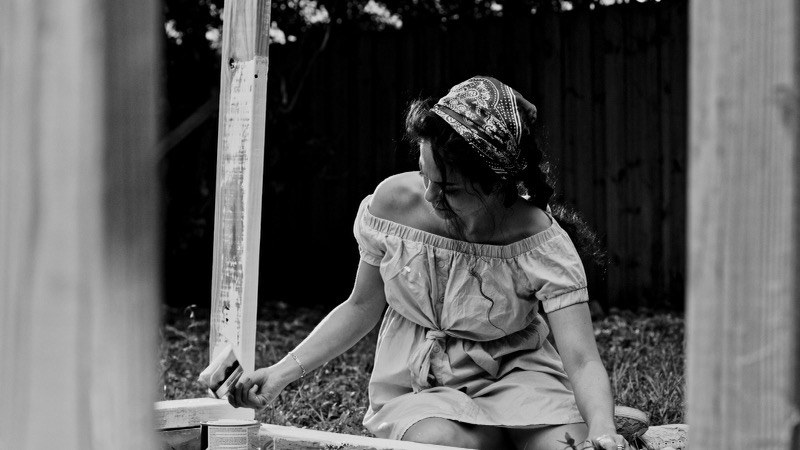 Brush in hand. Bandana, sundress, the work.