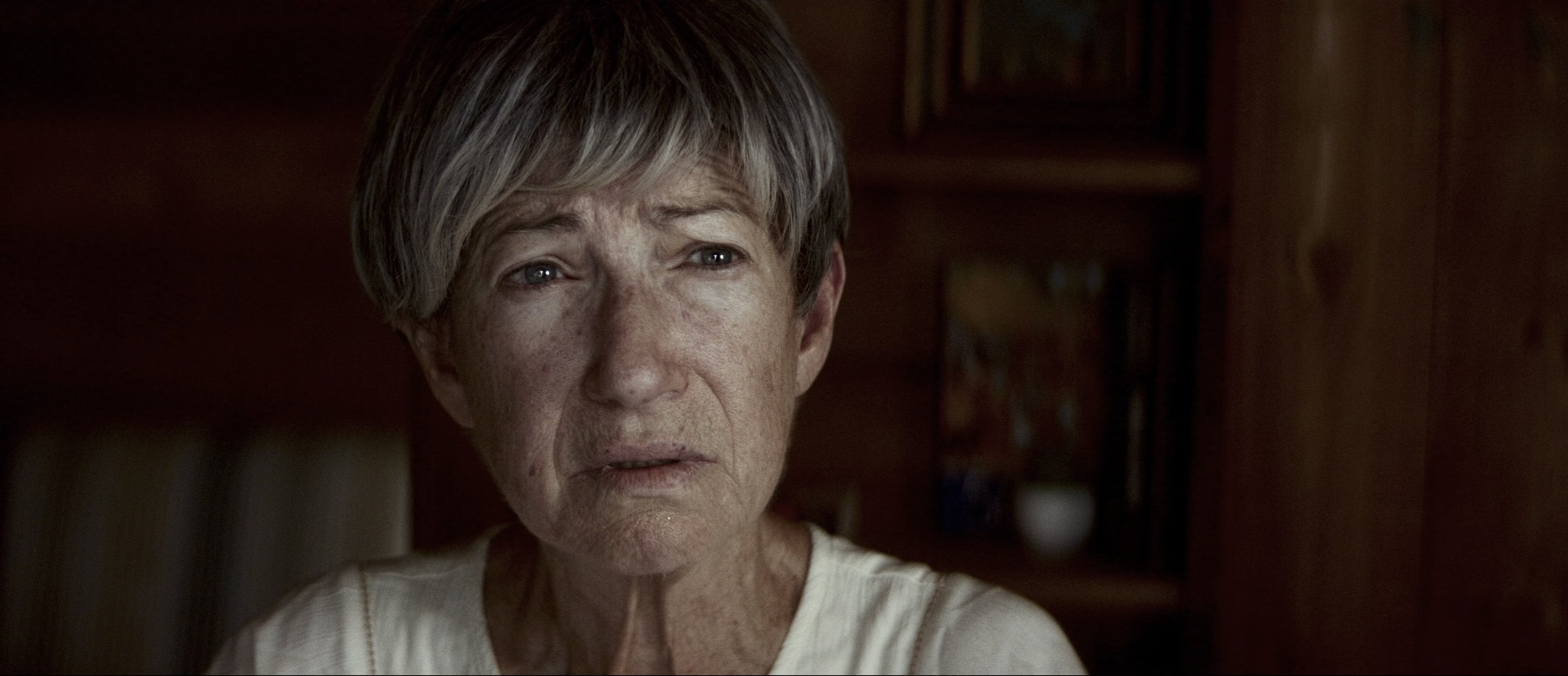 Close-up. A tear held at the corner of the eye.