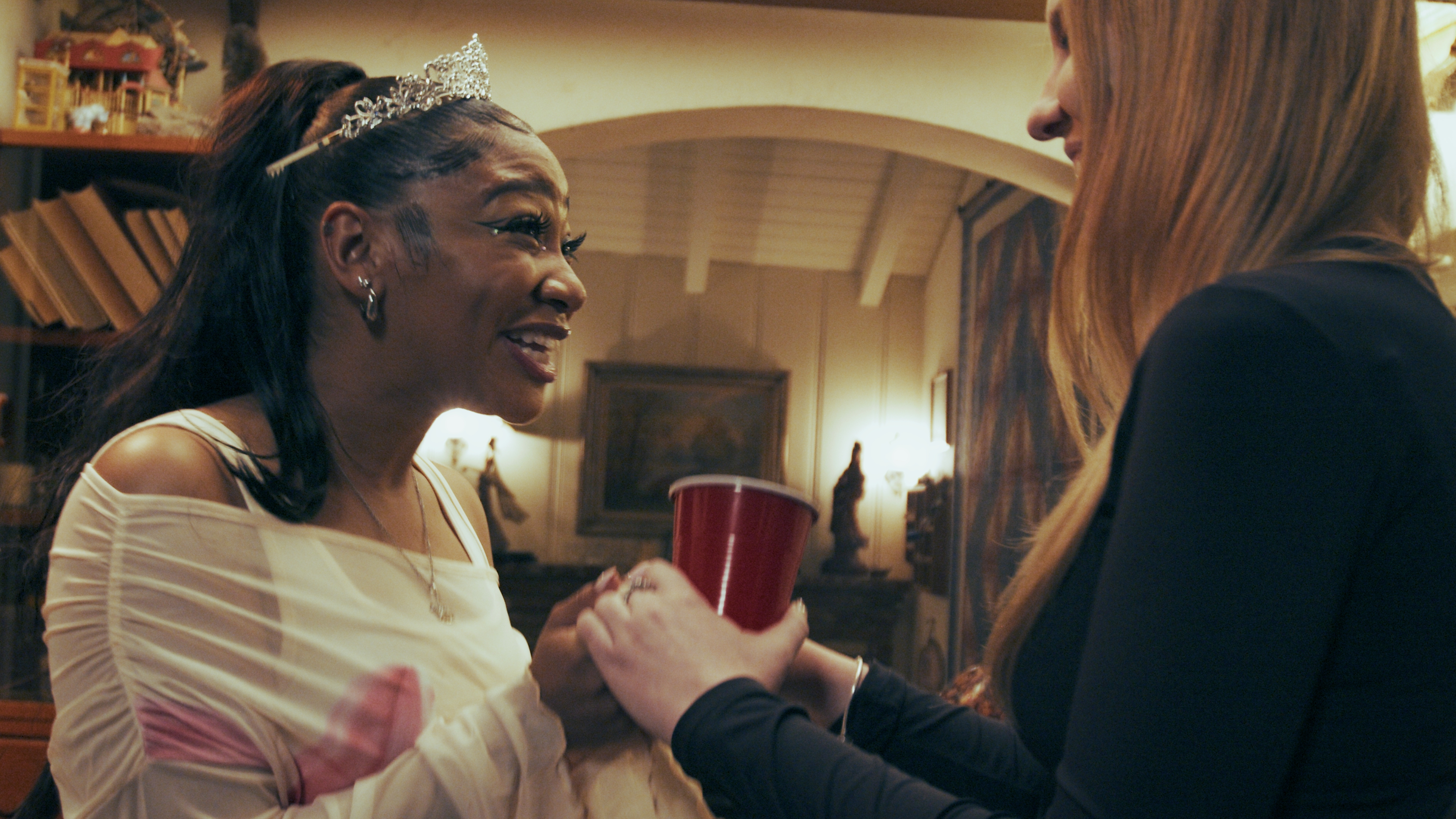 Tiara, red cup, conversation.